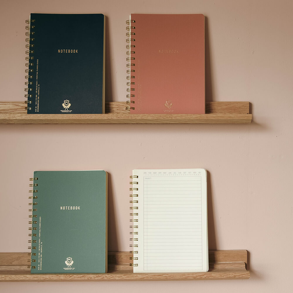 note books in 4 colours on picture ledges