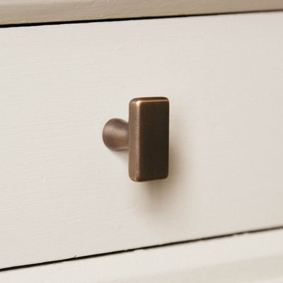obling capital cupboard knob seen mounted vertically