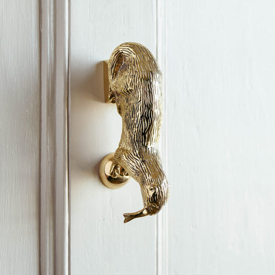 otter door knocker on door showing detail