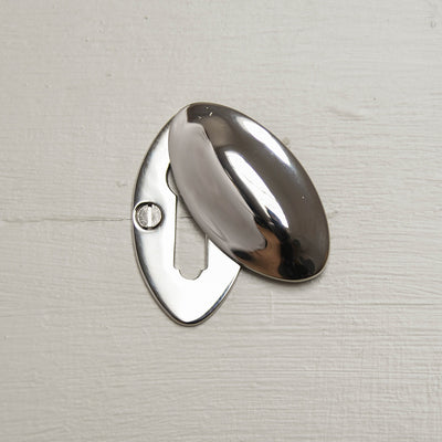 Oval keyhole escutcheon with open cover