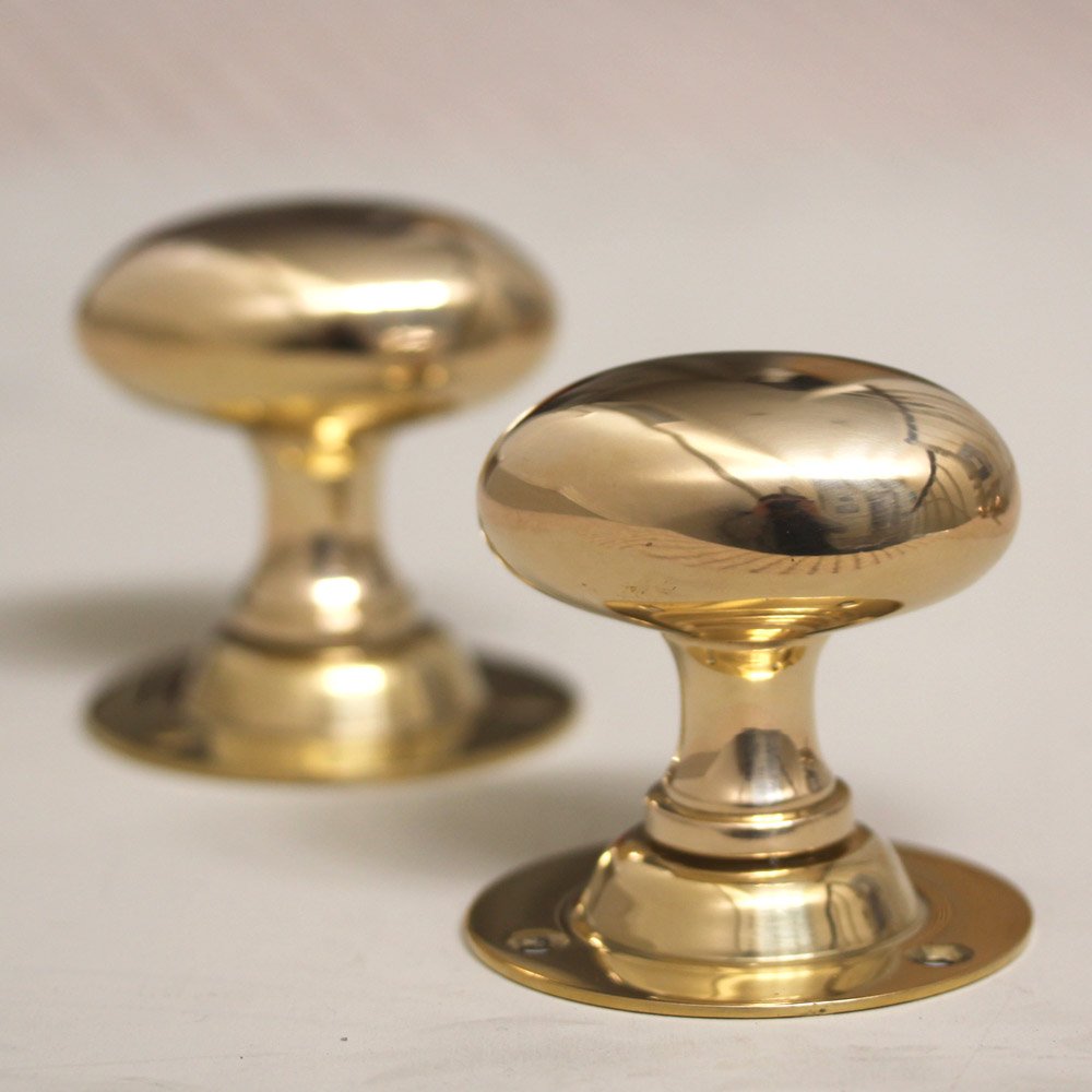 Oval brass door knobs