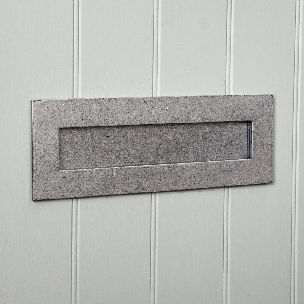 A letter plate  in a pewter patina finish fitted
