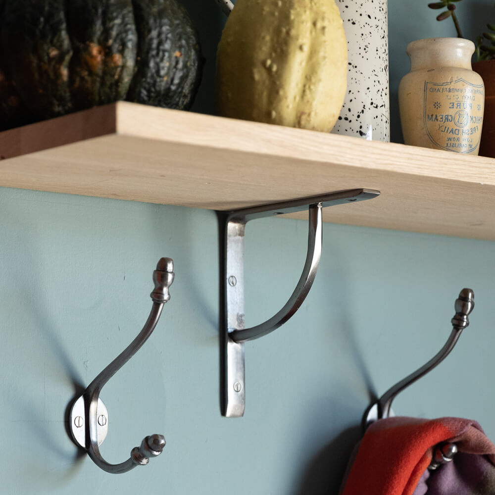 Plain Natural Iron Shelf Bracket shown with shelf and matching hooks