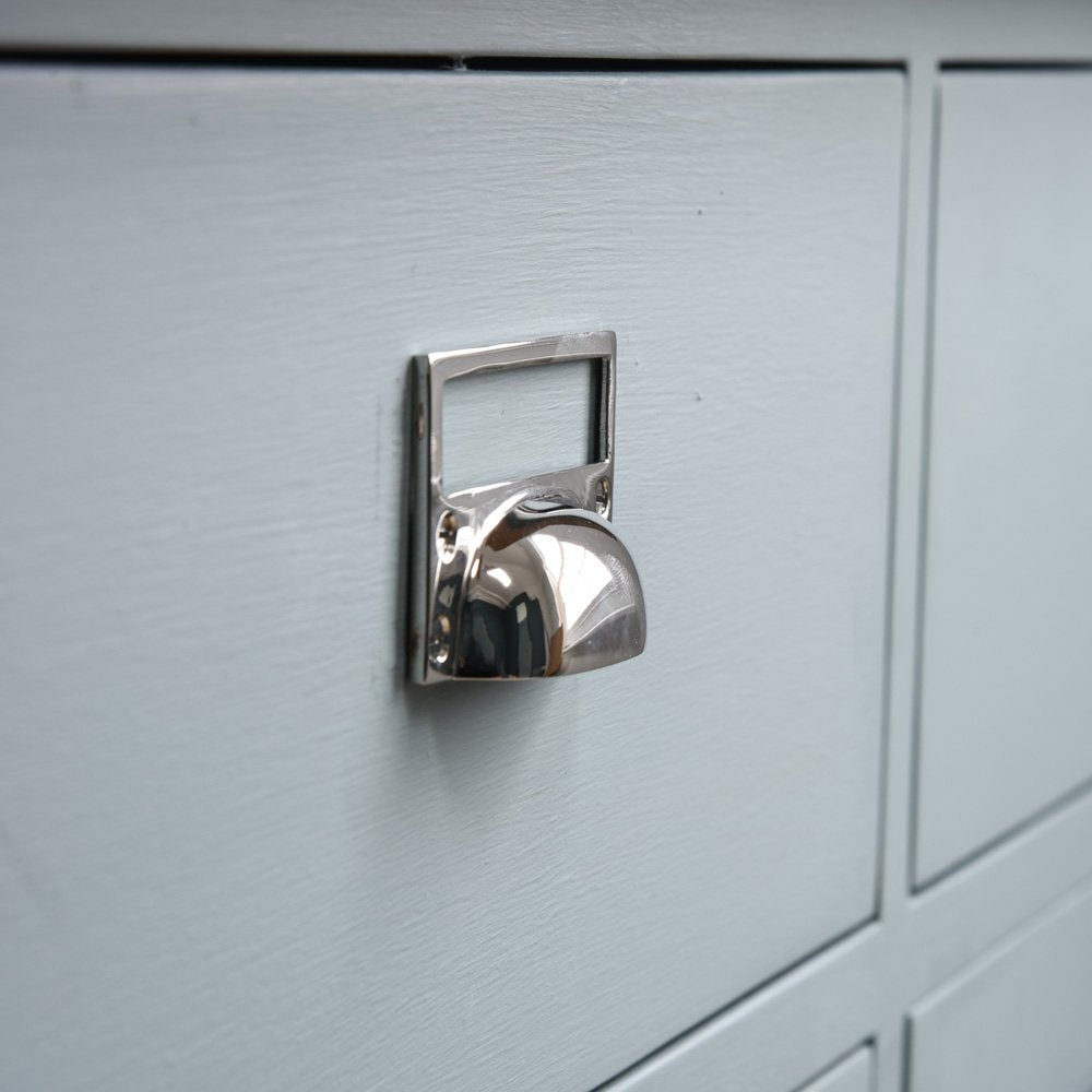 Hooded drawer pull with card frame on drawer