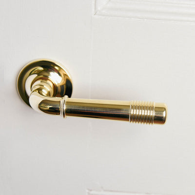 British made lever door handle in polished brass