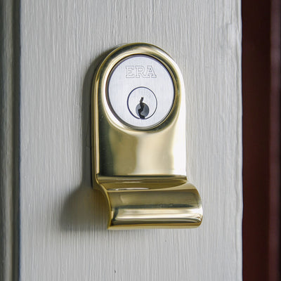 Polished Brass Cylinder latch pull on front door