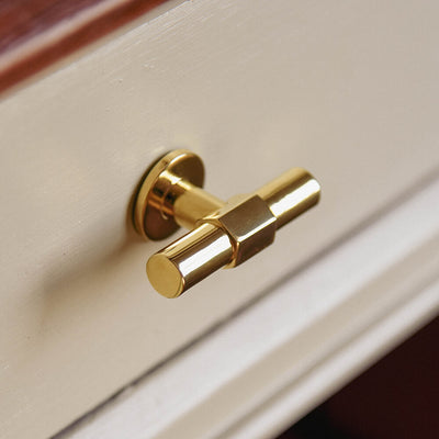 Fusion T Bar Cupboard knob or darwer pull in the style of a tap in polished brass seen from an angle showing its form