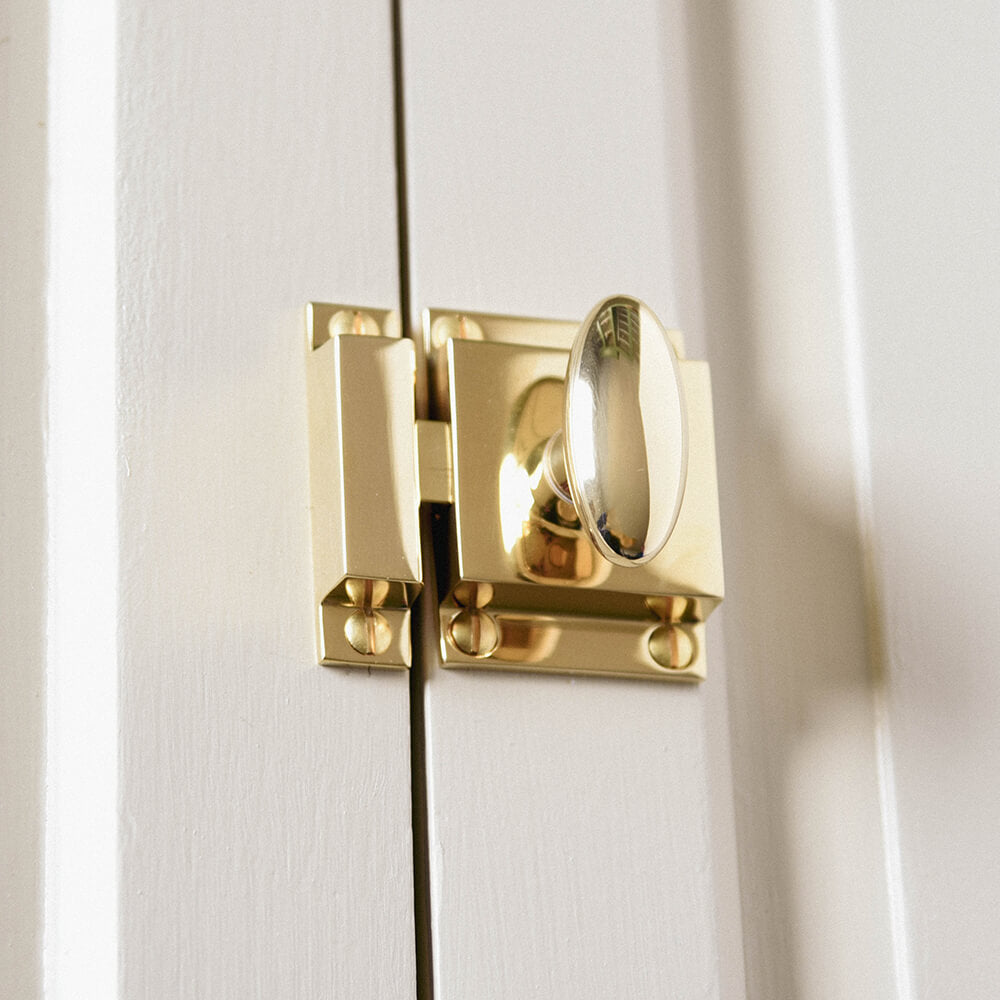 Polished Brass Zeppelin Cabinet Latch on doors