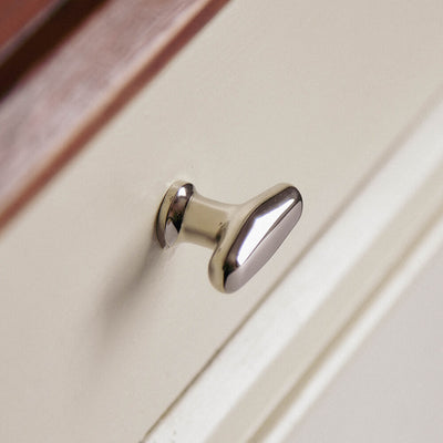 Elegance Nickel cabeint knob on angel showing the shape of the neck situated on drawer
