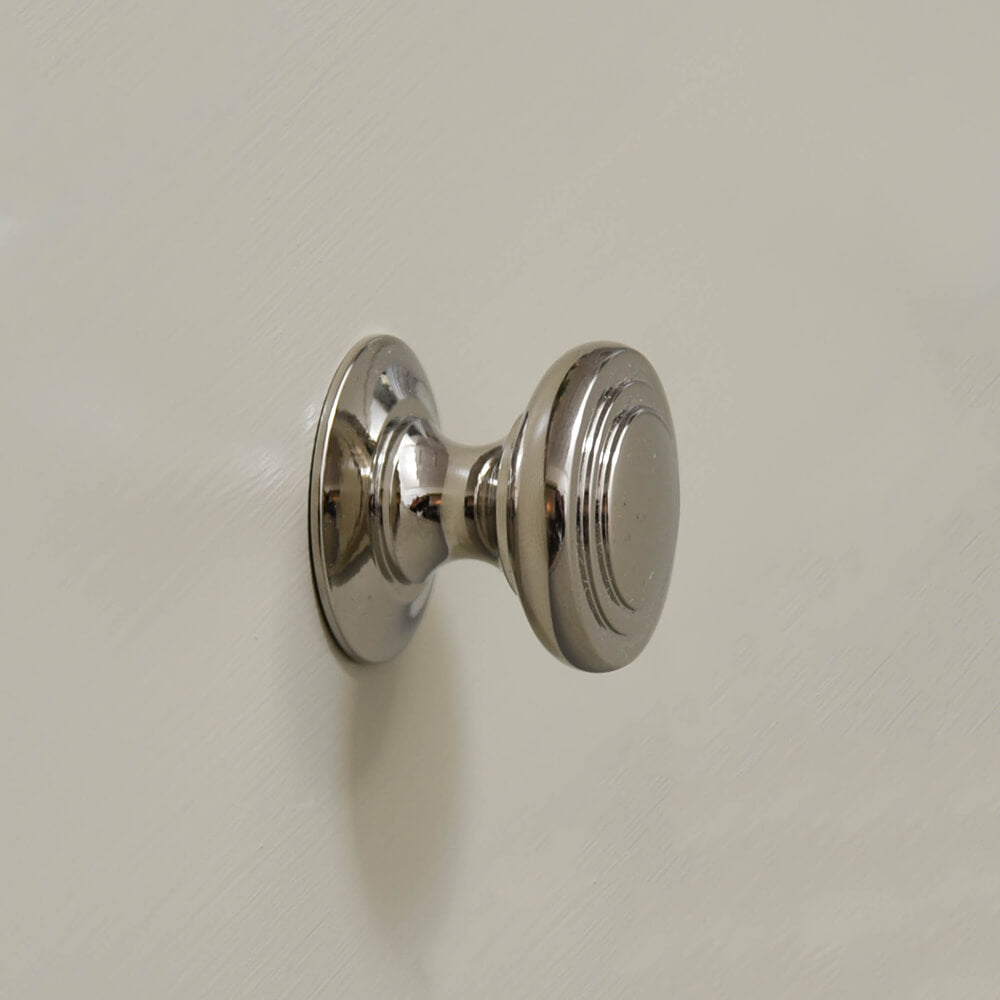 Polished Nickel Stepped Cushion Cabinet Knob from the side