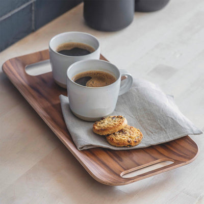 Rectangular walnut tray carrying two cups of coffee and biscuits