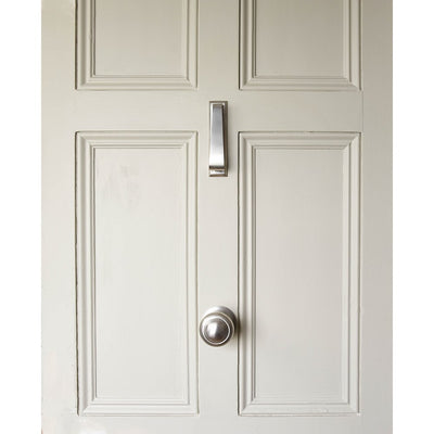 Slim door knocker and round centre door pull on front door