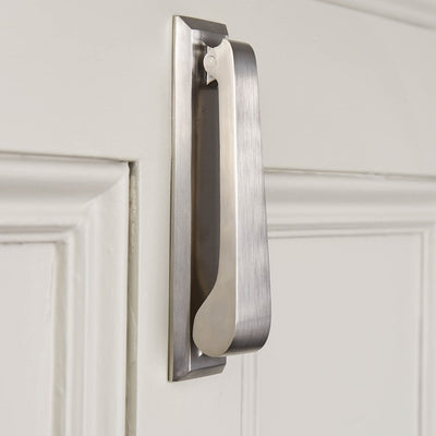 Angled image of plain rectangular door knocker