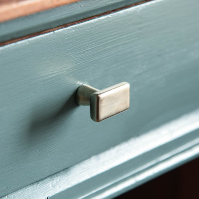 Satin Nickel Capital Cabinet knob on blue drawer