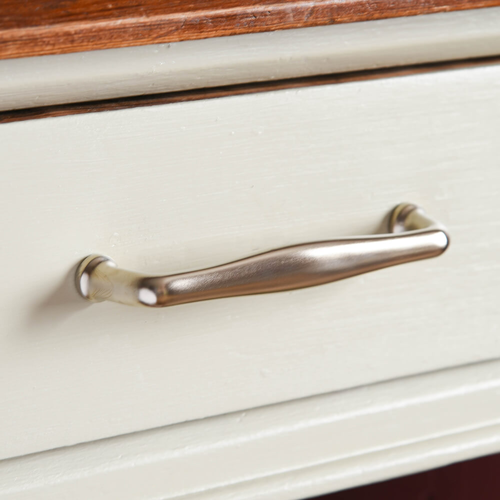 Satin Nickel Elegance Pull Handle on a kitchen drawer. British made.