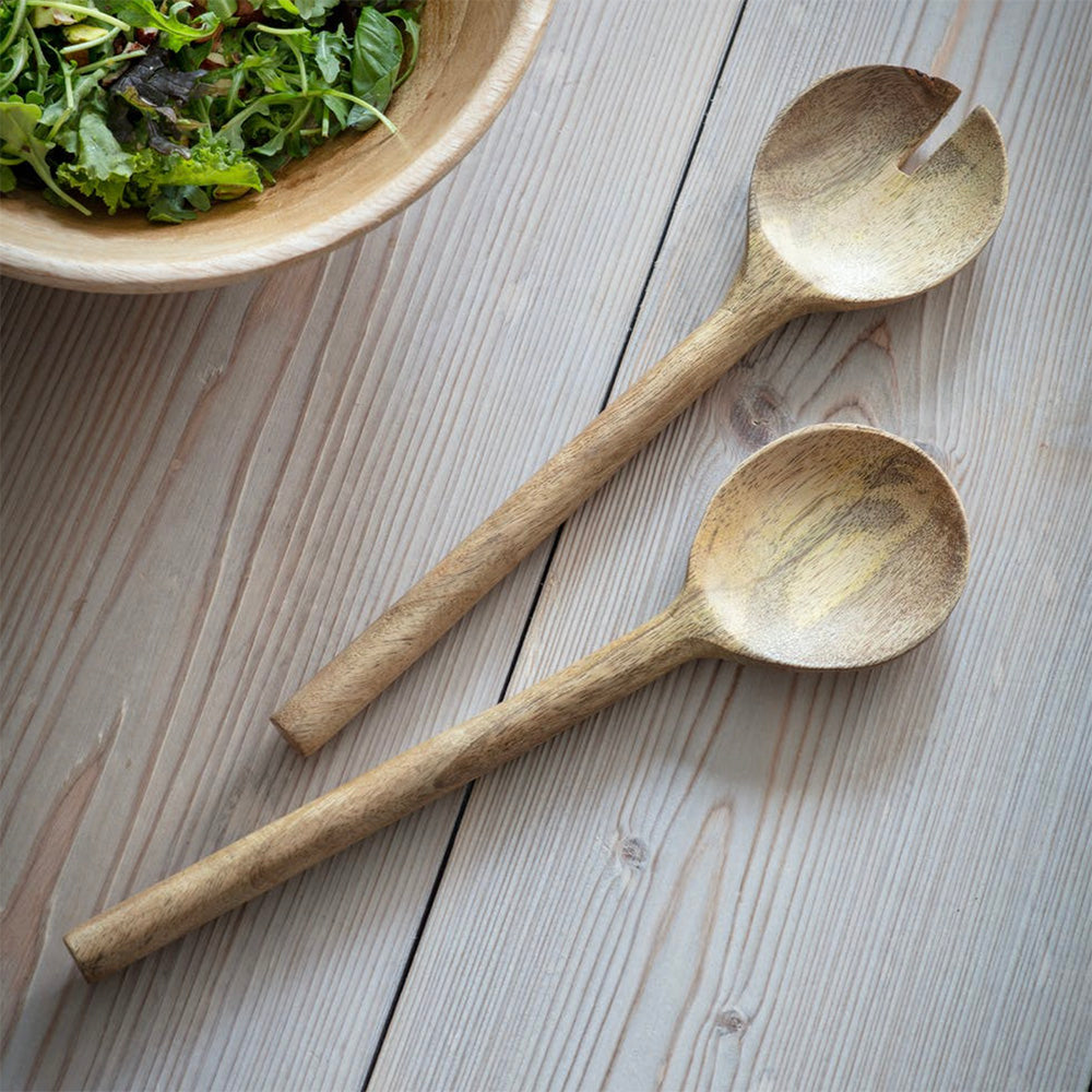 Set of midford wooden serving spoons next to salad bowl