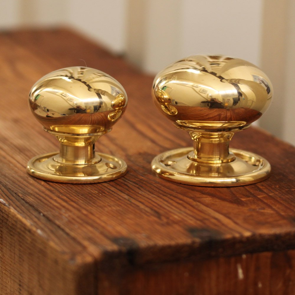 Small and large brass cottage bun door knobs