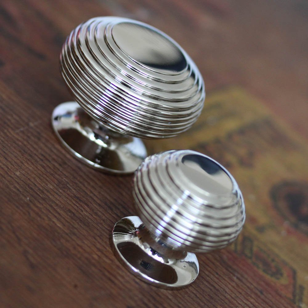 Small and large nickel beehive cabinet knobs