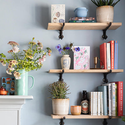 Oak Shelves displaying household objects in row of 3