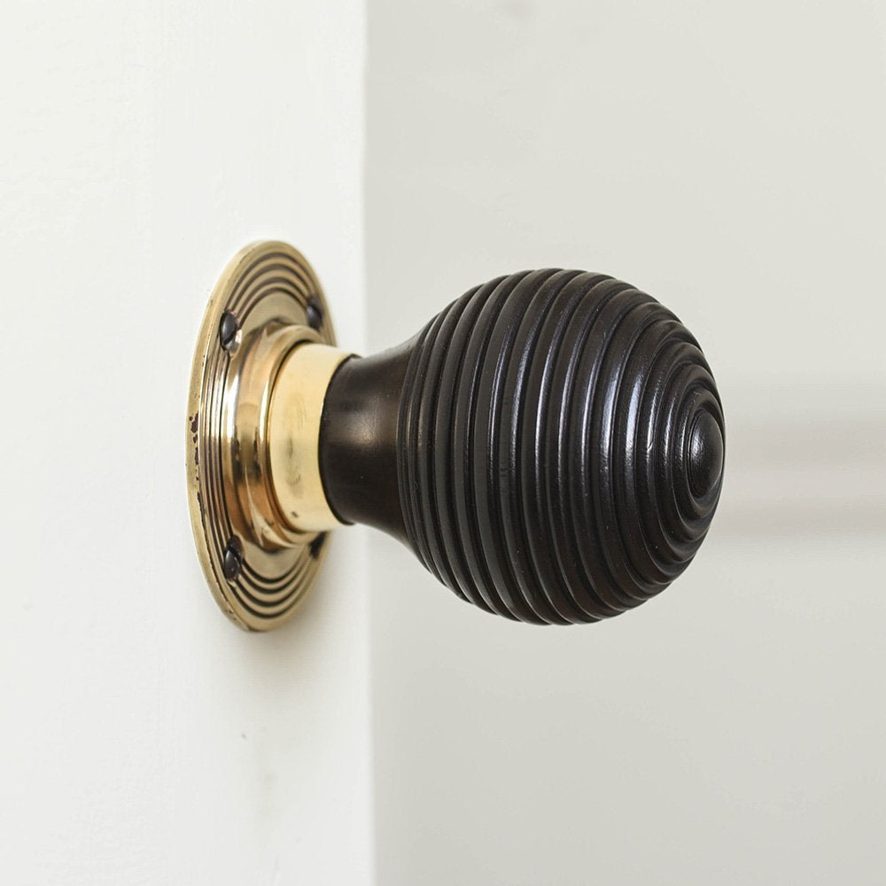 Solid ebony and brass beehive door knob