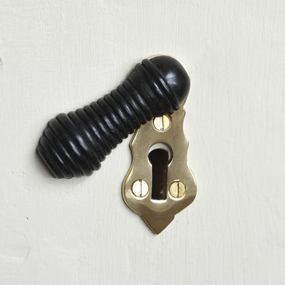Solid ebony and brass beehive escutcheon open