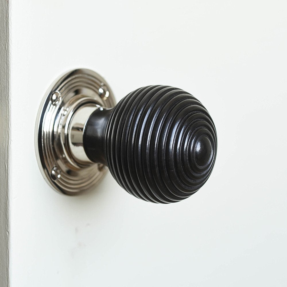 Solid ebony and nickel beehive door knob