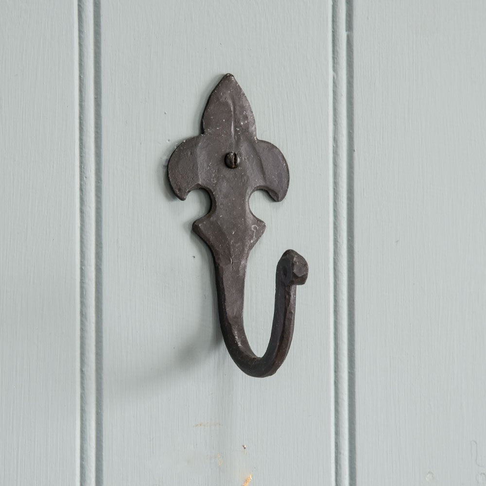 A traditional Fleu De Lys Hook showing the black beeswax finish and backplate detail