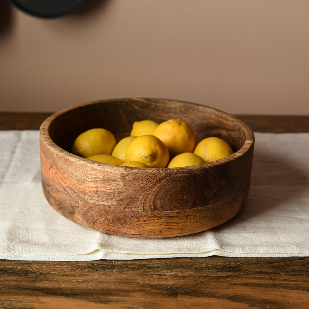 Wooden fruit bowl with lemons