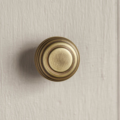 Front view of Queen Anne Beehive Cabinet Knob in Light Antique Brass.