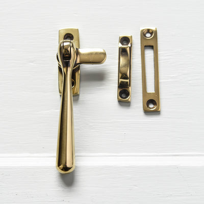 The Newbury Window Locking Fastener shown with a mortise plate and a hook plate