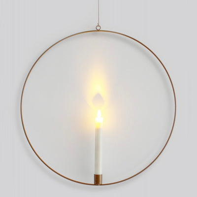 Hanging copper metal ring holding light up dinner style candle