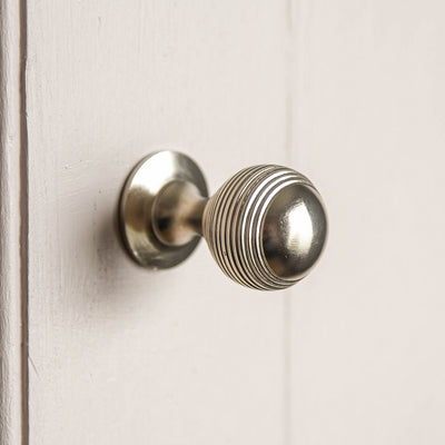 Alternate angle of solid brass Reeded Beehive Cabinet Knob in Brushed Nickel.
