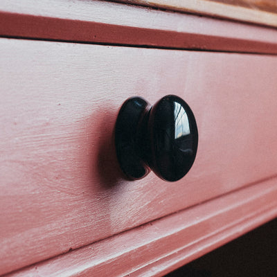 Black Ceramic Cabinet Knob Fitted on Pink Drawer