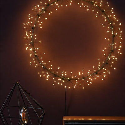 Black Starburst LED Light Wreath Lit Up at Night