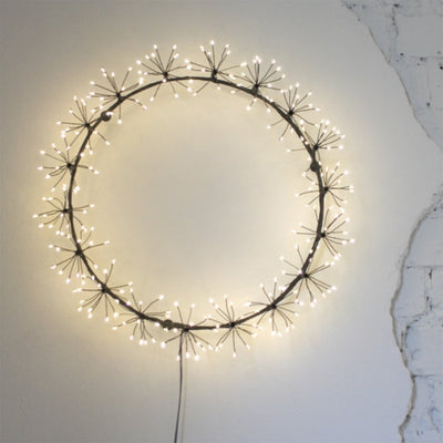 Black Starburst LED Light Wreath on Wall