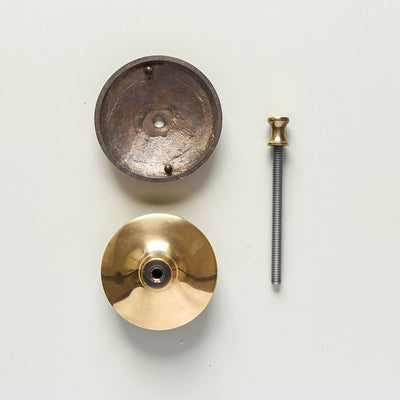 A reverse photo of the door pull showing the backplate fitting and the through bolt fixing