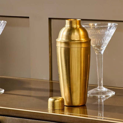 Brass Cocktail Shaker on Table with Cocktail Glass