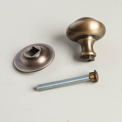 Components of solid brass Round 3 inch Door Pull in Light Antique finish.