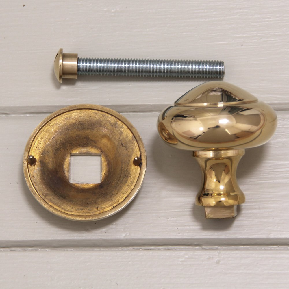 Components of Round 3 inch Door Pull in Polished Brass.