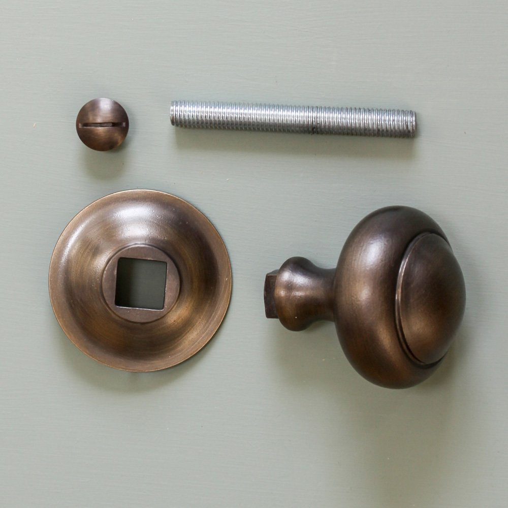 Components of Round 3 inch Door Pull in Distressed Antique finish.