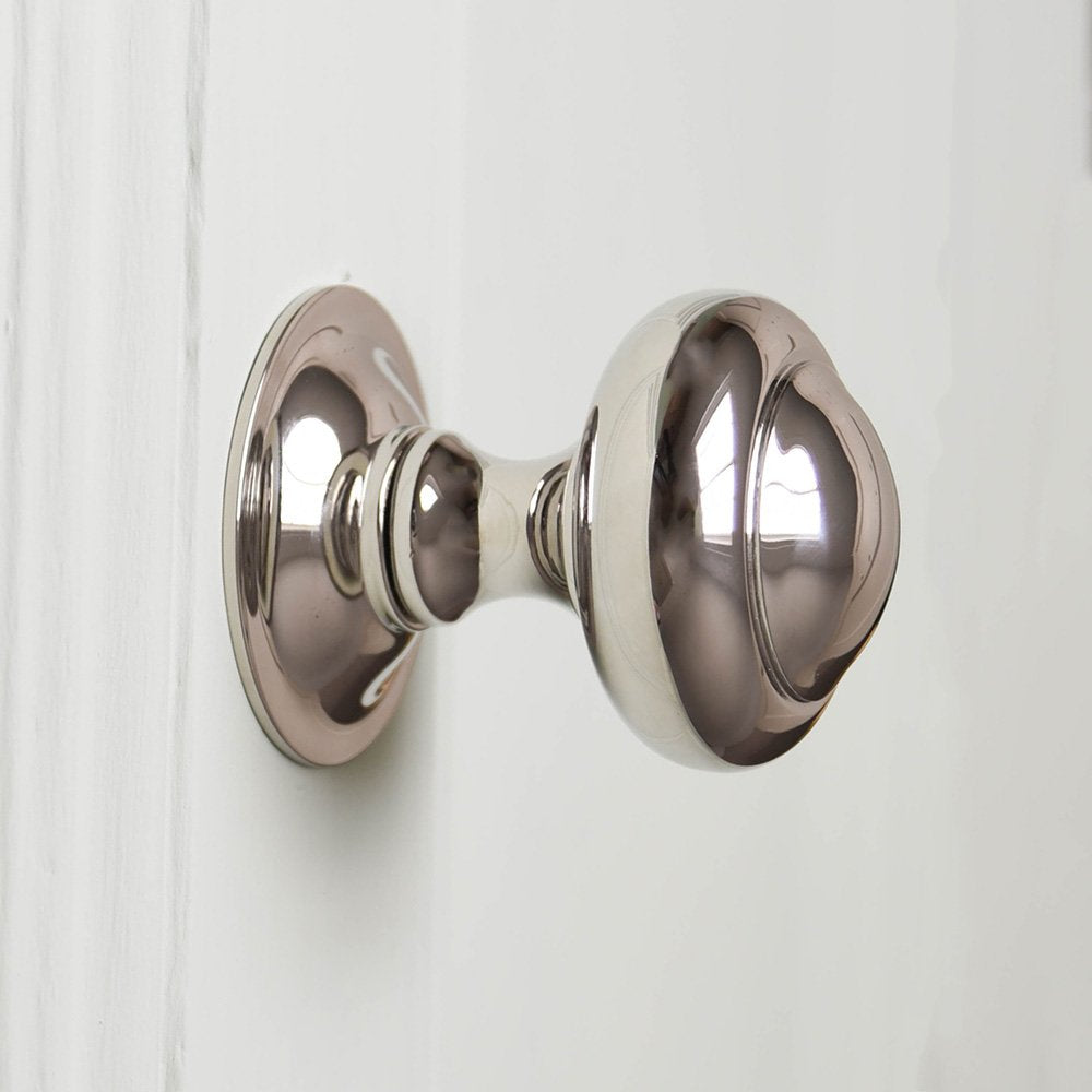 Close up of Round 3 inch Polished Nickel Door Pull.