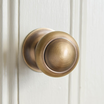 Front view of solid brass Round 3 inch Door Pull in Light Antique finish.