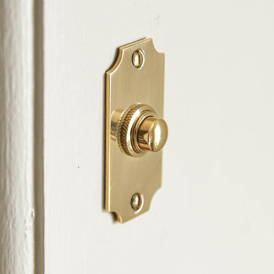 Concave Edge Bell Push in Polished Brass from Side