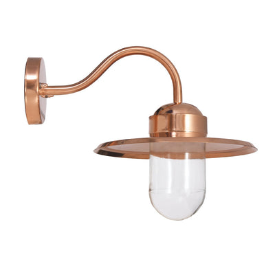 Stock image of copper wall light with clear glass shade
