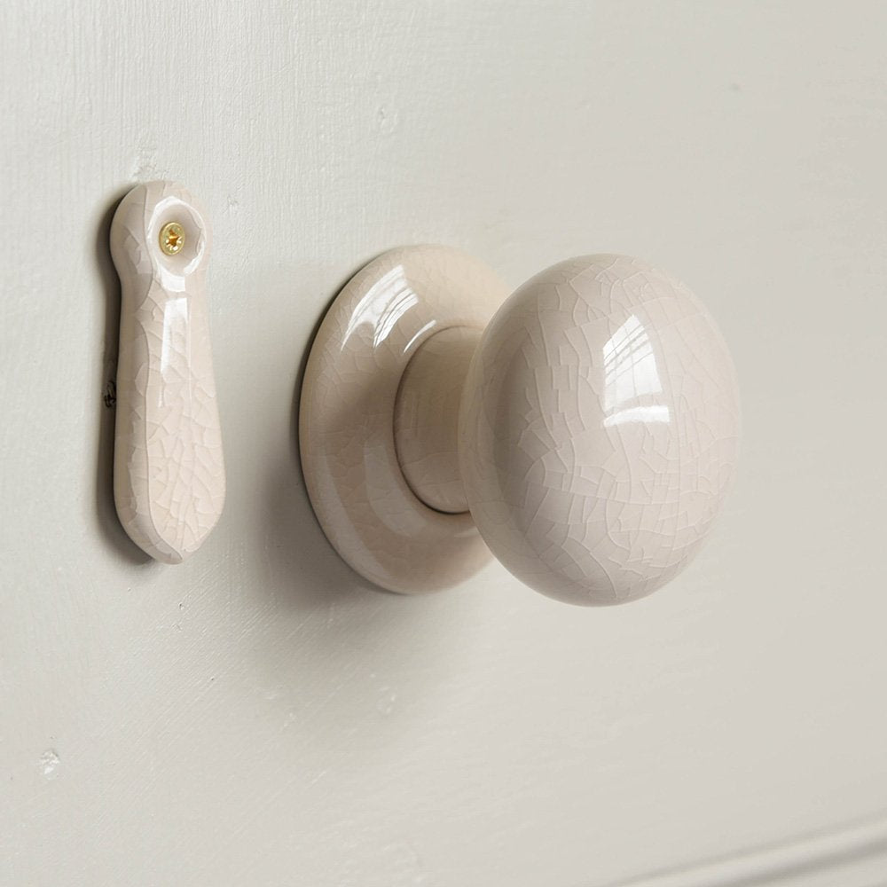 Cream Crackle Glaze Ceramic Door Knobs on Door with Matching Escutcheon