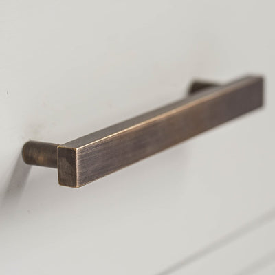 Detail of Cuboid Drawer Pull Handle in Distressed Antique Brass