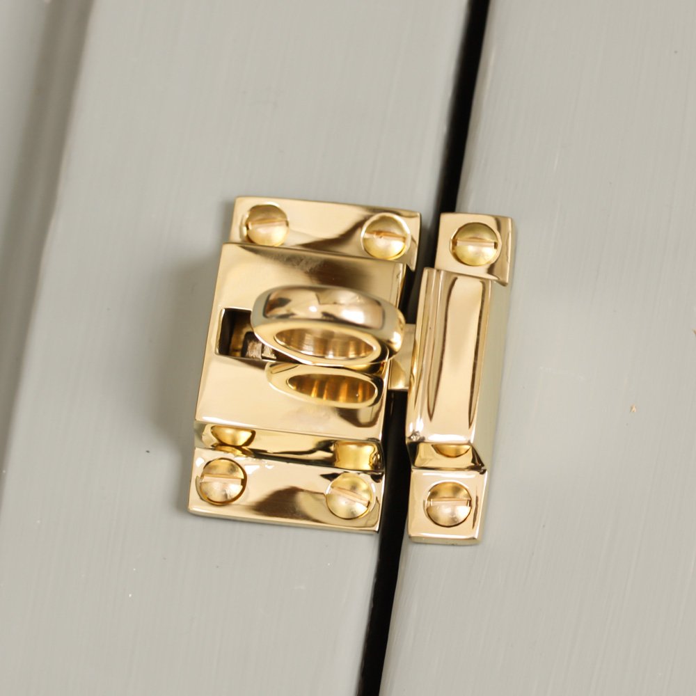 Solid brass Ring Catch on cupboard door.