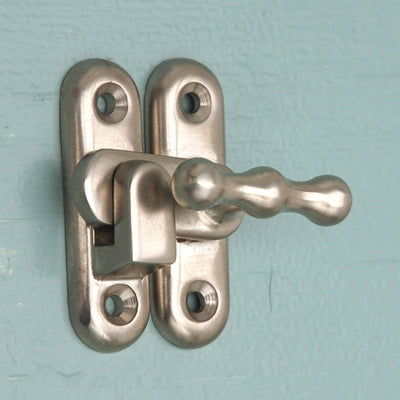 Close up of solid brass Satin Nickel plated Cupboard Catch.