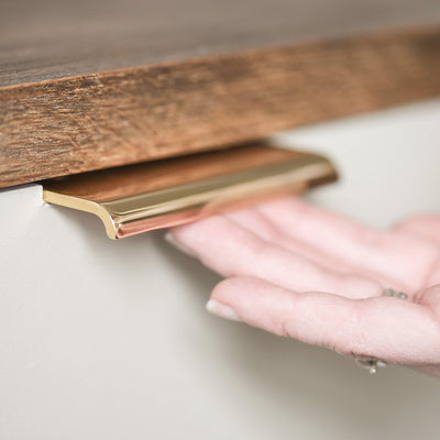 Curved Cabinet Edge Pull in Polished Brass in Use