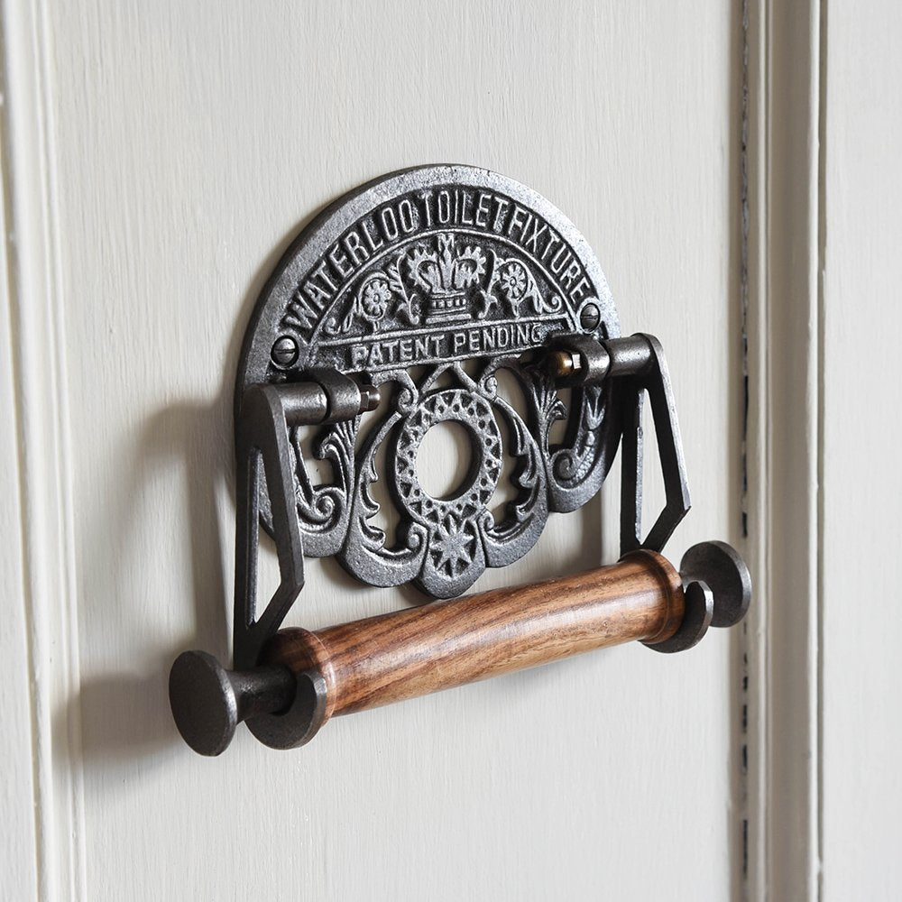 Decorative Cast Iron Toilet Roll Holder with Ornate 'WATERLOO TOILET FIXTURE' Text Plaque and Wooden Roller